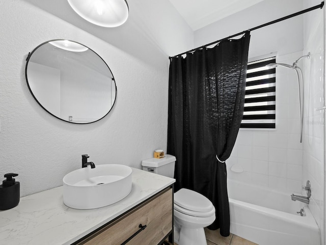 bathroom featuring toilet, shower / tub combo, vanity, and a textured wall