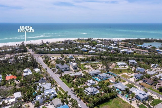 aerial view of property's location featuring expansive coastline and nearby suburban area