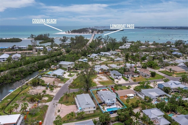 aerial view of residential area with a nearby body of water