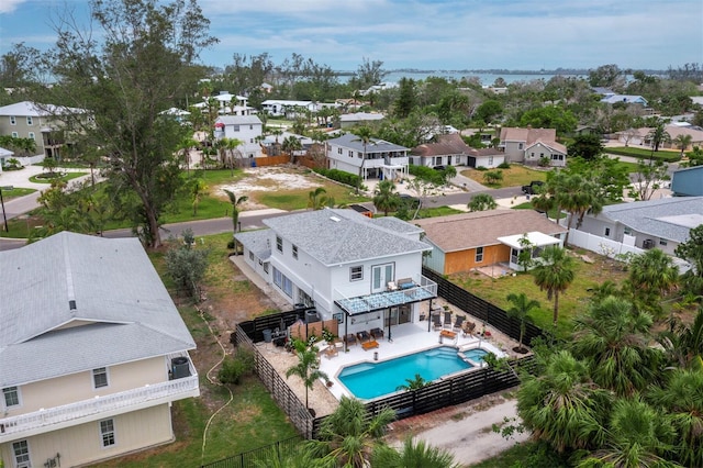 aerial view of residential area with a pool