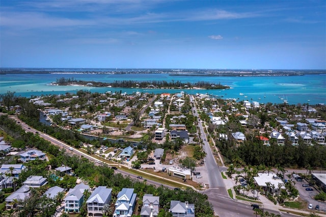 aerial overview of property's location with nearby suburban area and a large body of water