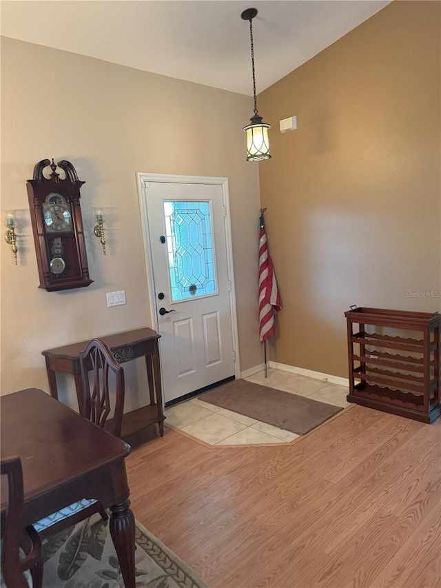 40 Mariner Ln, Rotonda West, FL 33947 - foyer entrance featuring light wood-style flooring and baseboards