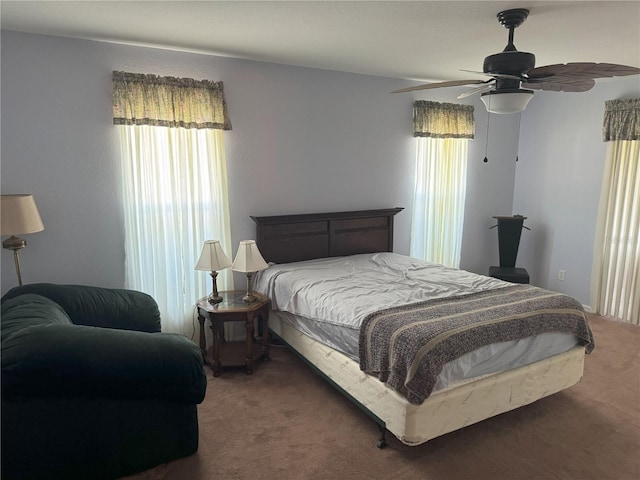 40 Mariner Ln, Rotonda West, FL 33947 - bedroom with multiple windows, carpet floors, and ceiling fan