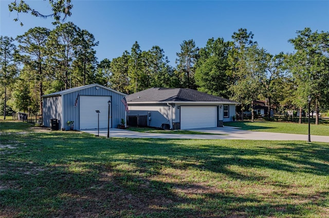 9085 SW 202nd Avenue Rd, Dunnellon, FL 34431 - view of front of home featuring a front yard, an outdoor structure, and a garage