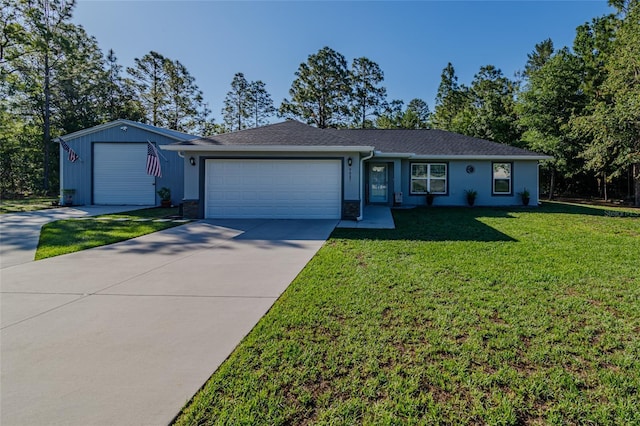 9085 SW 202nd Avenue Rd, Dunnellon, FL 34431 - ranch-style home featuring a front lawn, concrete driveway, and a garage