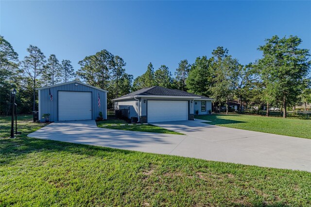 9085 SW 202nd Avenue Rd, Dunnellon, FL 34431 - view of front of house with a front lawn and an outbuilding