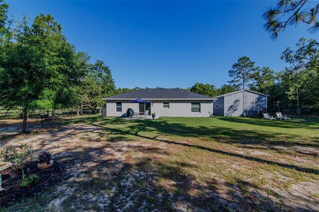 9085 SW 202nd Avenue Rd, Dunnellon, FL 34431 - back of property featuring stucco siding and a patio area