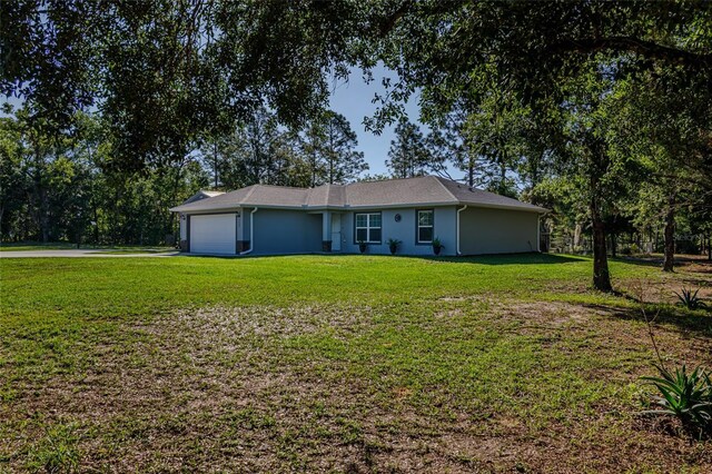 9085 SW 202nd Avenue Rd, Dunnellon, FL 34431 - single story home featuring a front lawn and an attached garage