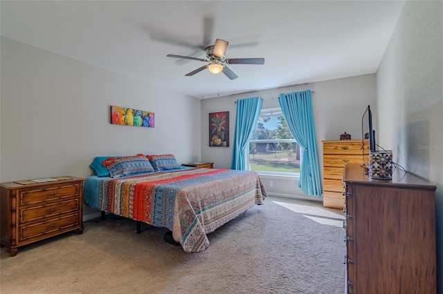 9085 SW 202nd Avenue Rd, Dunnellon, FL 34431 - bedroom with light carpet, a ceiling fan, and baseboards