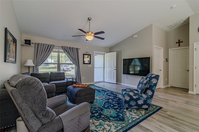 9085 SW 202nd Avenue Rd, Dunnellon, FL 34431 - living room with lofted ceiling, a ceiling fan, light wood-style floors, and baseboards
