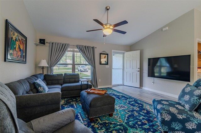 9085 SW 202nd Avenue Rd, Dunnellon, FL 34431 - living room with lofted ceiling, wood finished floors, ceiling fan, and baseboards