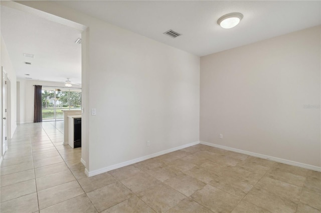 12183 Longview Lake Cir, Bradenton, FL 34211 - unfurnished room featuring light tile patterned floors, a ceiling fan, and baseboards