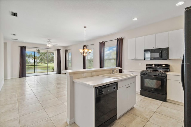 12183 Longview Lake Cir, Bradenton, FL 34211 - kitchen with black appliances, a sink, open floor plan, light tile patterned flooring, and healthy amount of natural light