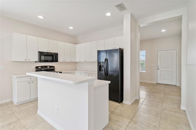 12183 Longview Lake Cir, Bradenton, FL 34211 - kitchen with black appliances, light countertops, light tile patterned floors, white cabinetry, and a kitchen island