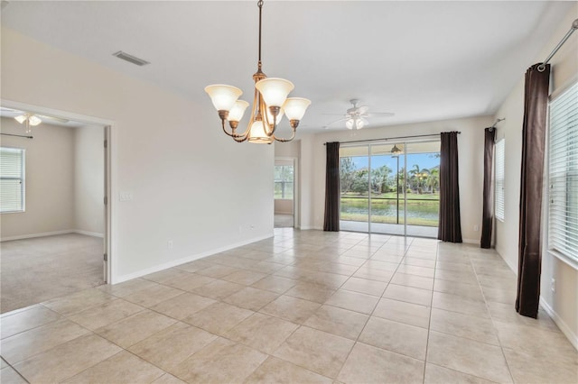 12183 Longview Lake Cir, Bradenton, FL 34211 - spare room featuring ceiling fan, light tile patterned flooring, a chandelier, and baseboards