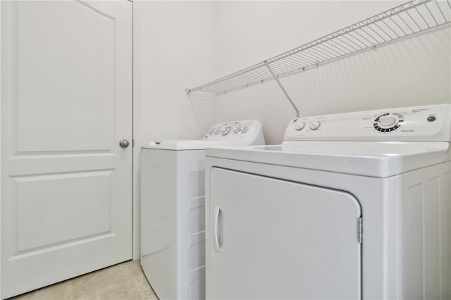 12183 Longview Lake Cir, Bradenton, FL 34211 - washroom featuring washing machine and dryer and light tile patterned flooring