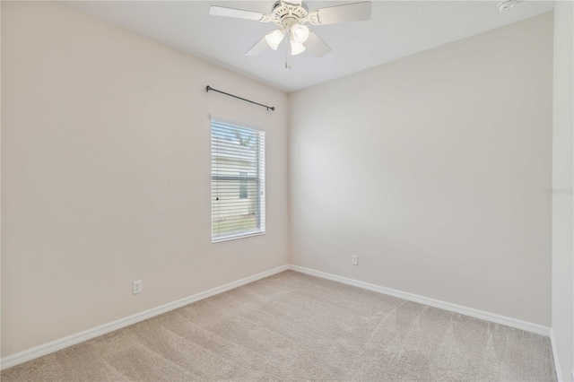 12183 Longview Lake Cir, Bradenton, FL 34211 - spare room featuring light carpet, baseboards, and ceiling fan