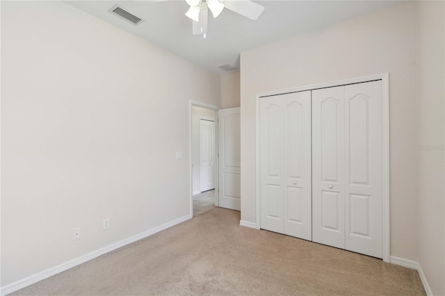 12183 Longview Lake Cir, Bradenton, FL 34211 - unfurnished bedroom featuring light colored carpet, a closet, baseboards, and a ceiling fan