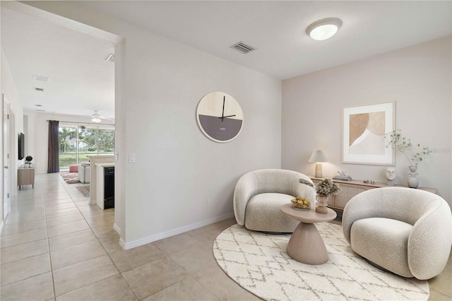 12183 Longview Lake Cir, Bradenton, FL 34211 - living area with light tile patterned flooring, a ceiling fan, and baseboards