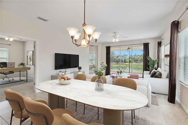 12183 Longview Lake Cir, Bradenton, FL 34211 - dining room with light tile patterned floors, a ceiling fan, and healthy amount of natural light