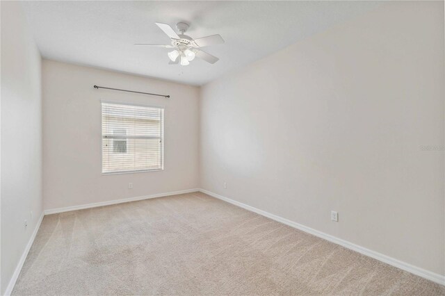 12183 Longview Lake Cir, Bradenton, FL 34211 - empty room with light carpet, baseboards, and ceiling fan