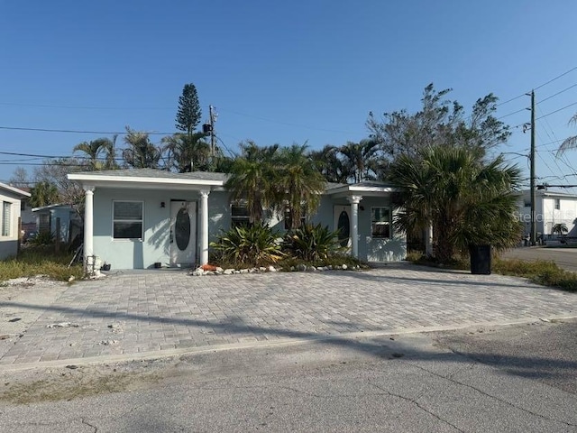 232 147th Ave E, Madeira Beach, FL 33708 - view of front of house featuring stucco siding