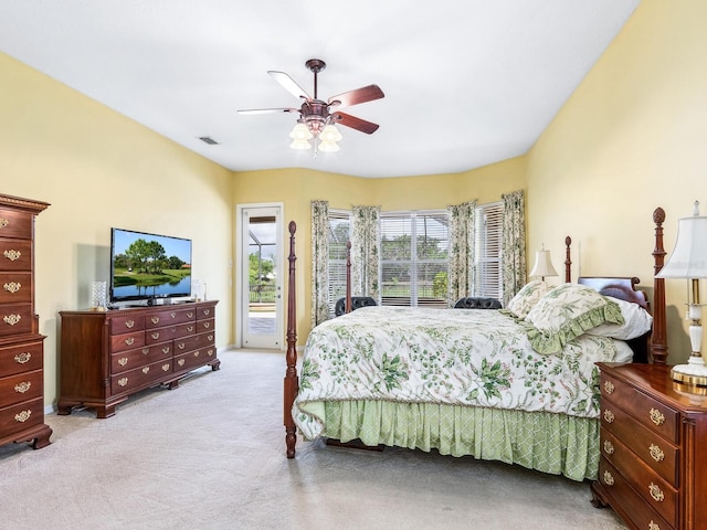 carpeted bedroom with access to exterior and a ceiling fan