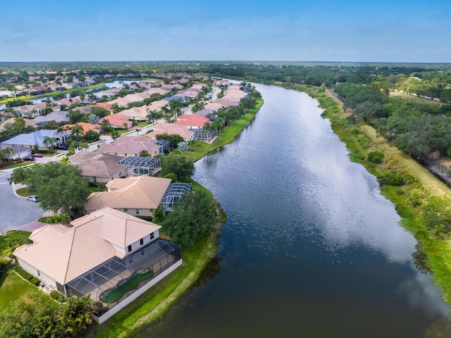 aerial perspective of suburban area featuring a nearby body of water