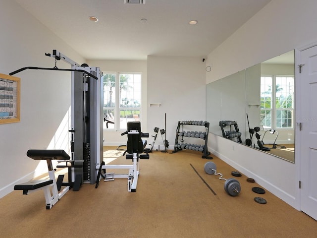 workout area with baseboards, carpet, and recessed lighting