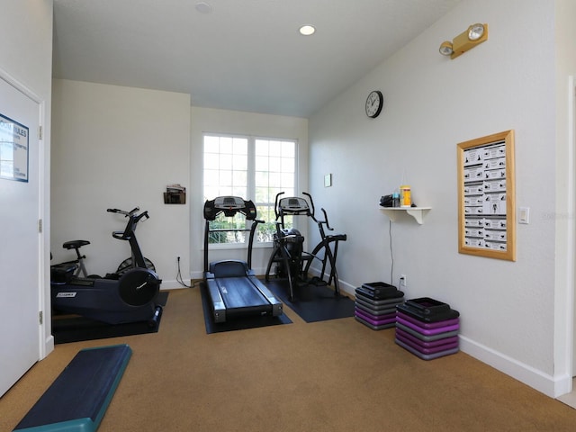 workout area with carpet flooring and baseboards