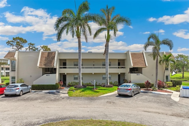 7193 W Country Club Dr N Unit 137, Sarasota, FL 34243 - view of property featuring uncovered parking