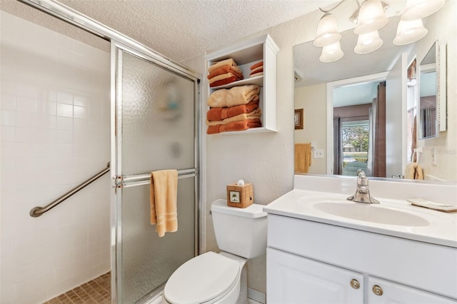 7193 W Country Club Dr N Unit 137, Sarasota, FL 34243 - bathroom featuring a stall shower, vanity, a textured ceiling, and toilet