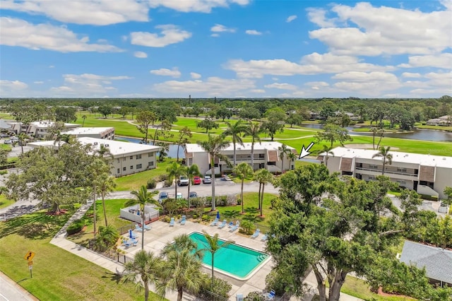 7193 W Country Club Dr N Unit 137, Sarasota, FL 34243 - bird's eye view of a large body of water, a golf course, a pool, and a tree filled landscape