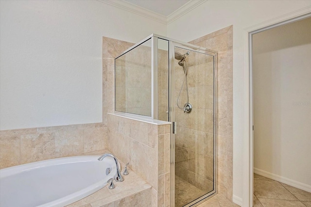 bathroom featuring a stall shower, ornamental molding, a bath, and tile patterned floors