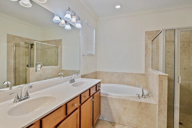 bathroom featuring a shower stall, a garden tub, tile patterned floors, ornamental molding, and double vanity