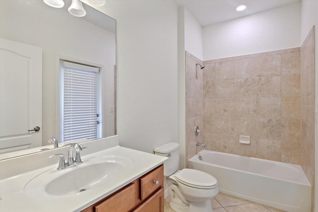 full bath featuring tile patterned floors, vanity, toilet, and bathing tub / shower combination