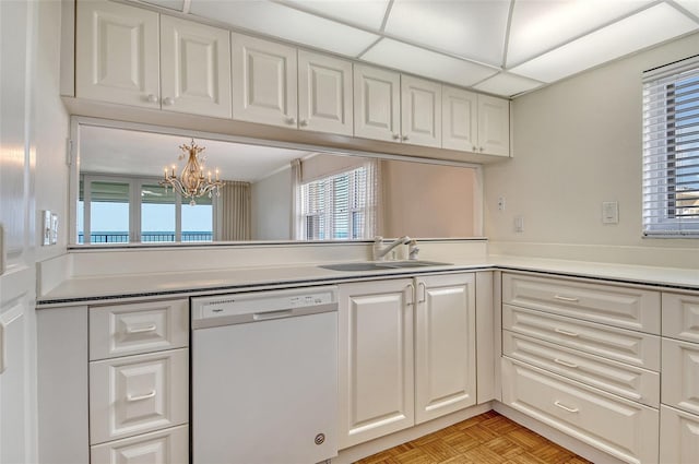 2675 Gulf Of Mexico Dr Unit 404, Longboat Key, FL 34228 - kitchen featuring dishwasher, healthy amount of natural light, and white cabinetry