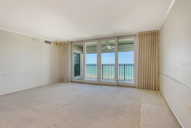 2675 Gulf Of Mexico Dr Unit 404, Longboat Key, FL 34228 - carpeted empty room featuring ornamental molding and ceiling fan