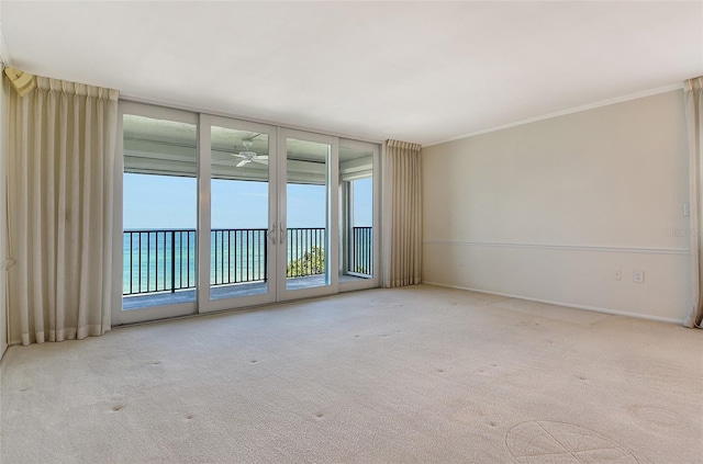 2675 Gulf Of Mexico Dr Unit 404, Longboat Key, FL 34228 - carpeted empty room with a ceiling fan and crown molding