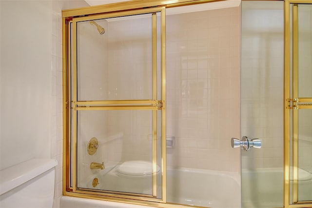 2675 Gulf Of Mexico Dr Unit 404, Longboat Key, FL 34228 - bathroom featuring toilet and shower / bath combination with glass door