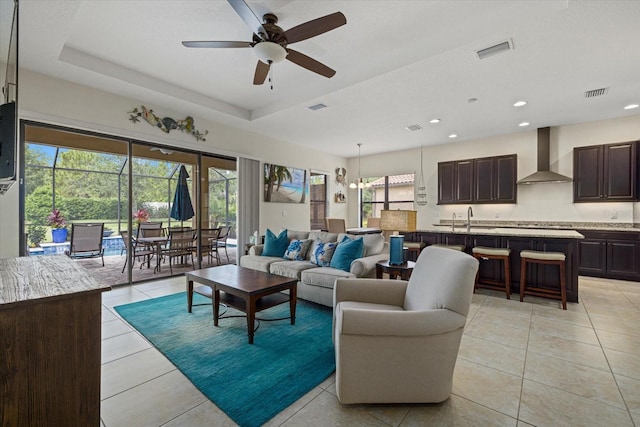 9769 Highland Park Pl, Palmetto, FL 34221 - living room featuring ceiling fan, light tile patterned floors, and recessed lighting