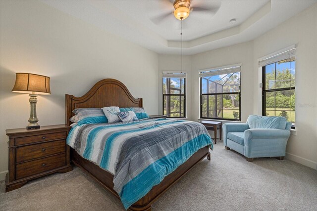 9769 Highland Park Pl, Palmetto, FL 34221 - bedroom featuring light colored carpet, baseboards, and a ceiling fan
