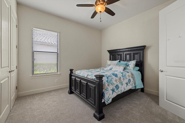 9769 Highland Park Pl, Palmetto, FL 34221 - bedroom featuring baseboards, light carpet, and a ceiling fan