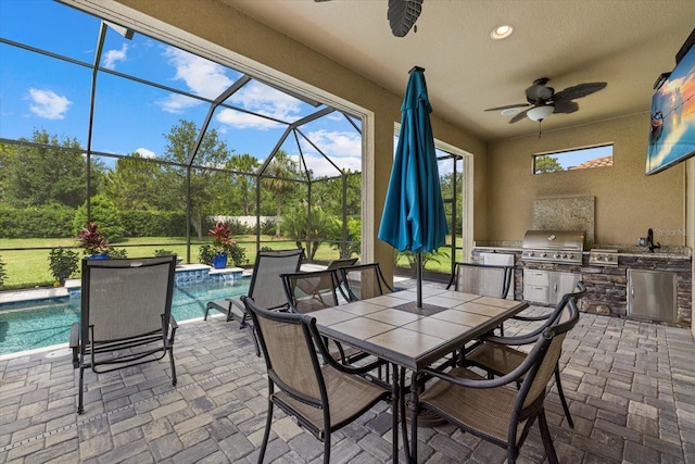 9769 Highland Park Pl, Palmetto, FL 34221 - view of patio / terrace with exterior kitchen, ceiling fan, a grill, and an outdoor pool