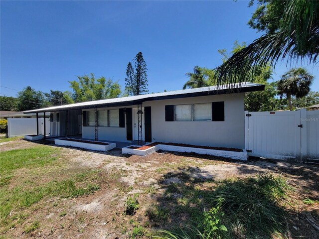 4210 Baird St, Sarasota, FL 34232 - single story home featuring fence, a gate, and stucco siding