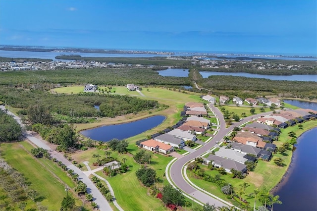 aerial overview of property's location featuring a nearby body of water and nearby suburban area