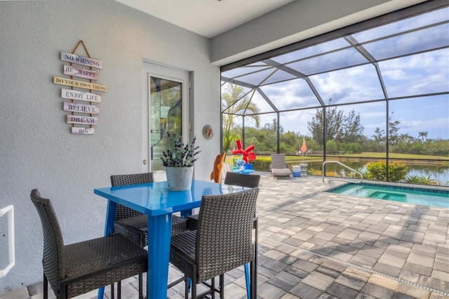 view of patio / terrace with an outdoor pool and a lanai