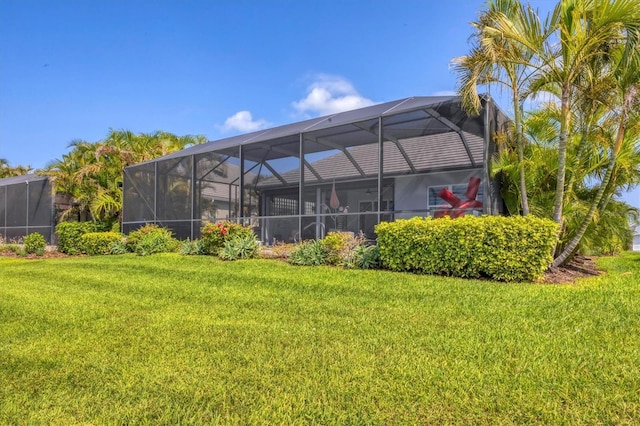 back of property with a lawn