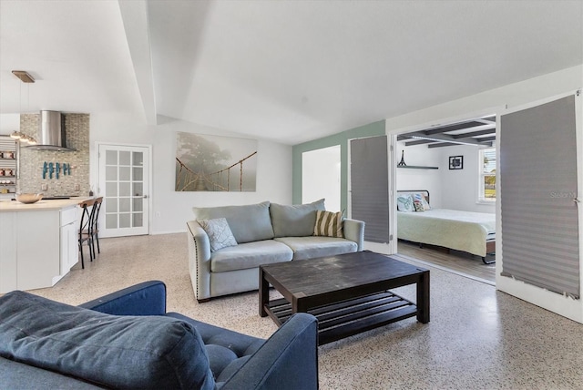 6931 Magellan Way, Sarasota, FL 34243 - living room featuring dark aggregate flooring and beam ceiling