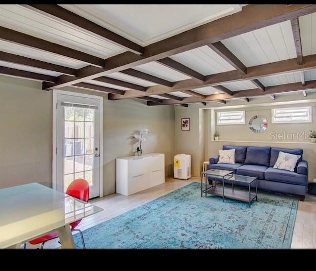 6931 Magellan Way, Sarasota, FL 34243 - living room featuring beam ceiling and wood finished floors